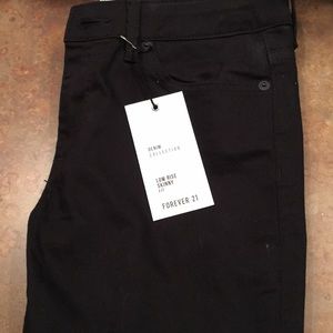 Low rise skinny black ripped at knee jeans